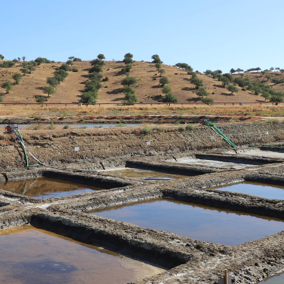 Crystallisation pans filling with brine, the hills of Castro Marim behind.